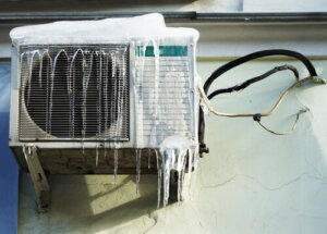 Are you supposed to cover your AC unit in winter?